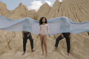 Models Posing by a Natural Rock Formation